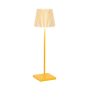 Yellow floor lamp with a striped shade on a white background